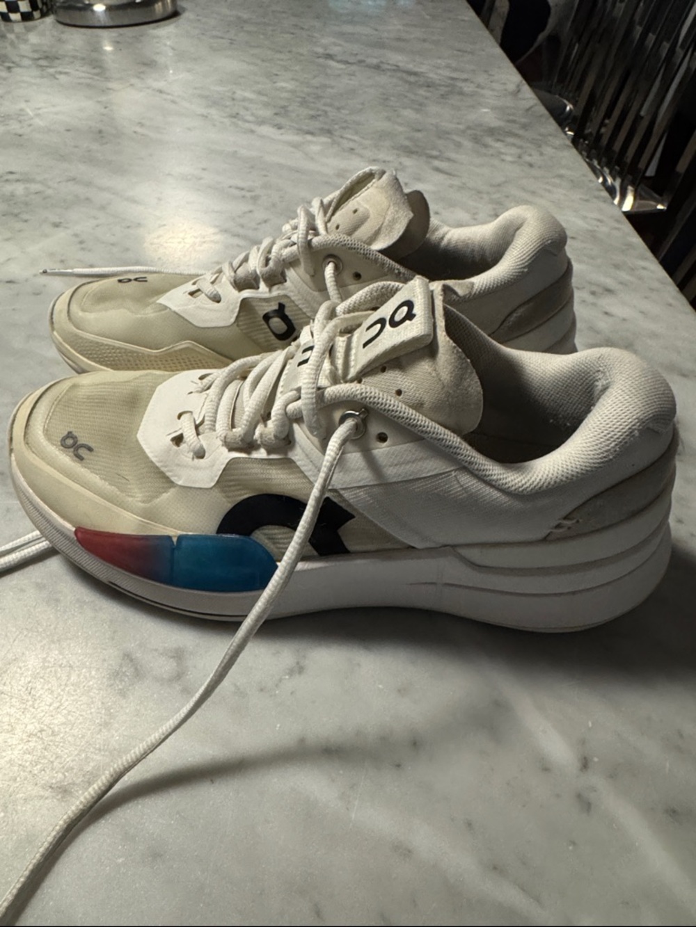 On Running Women's White Athletic Sneakers with Blue and Red Accent